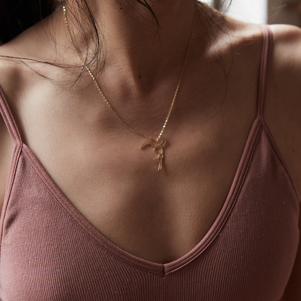 Embrace Fearlessness and Strength. Bold Balance: Handstand Necklace